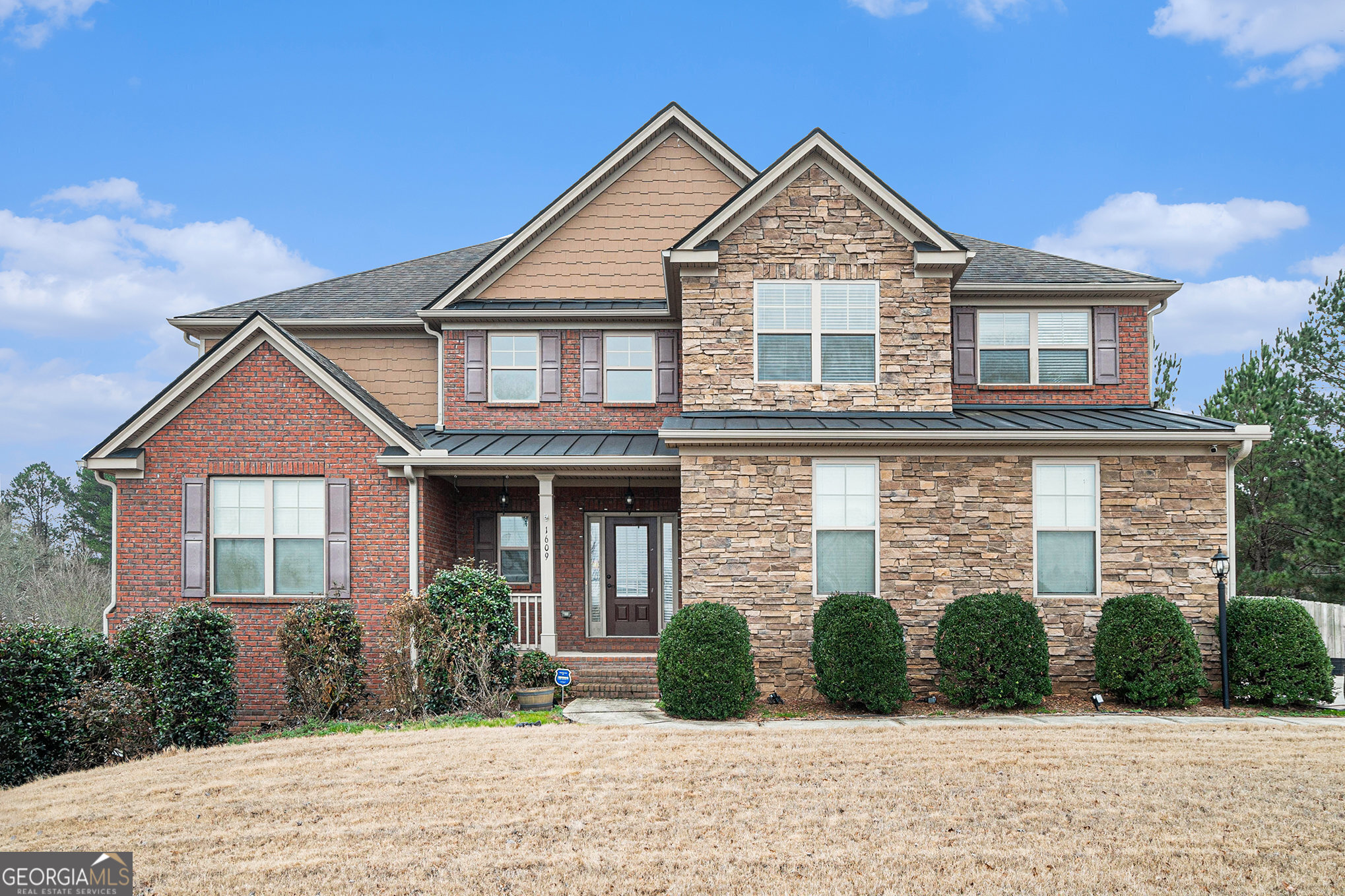 a front view of a house with a yard