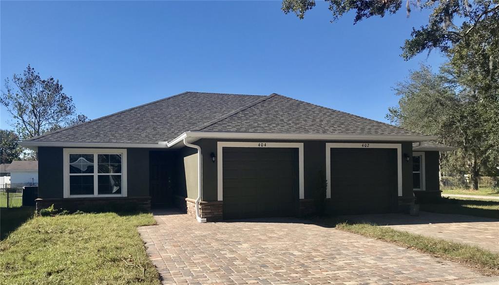 a front view of a house having yard