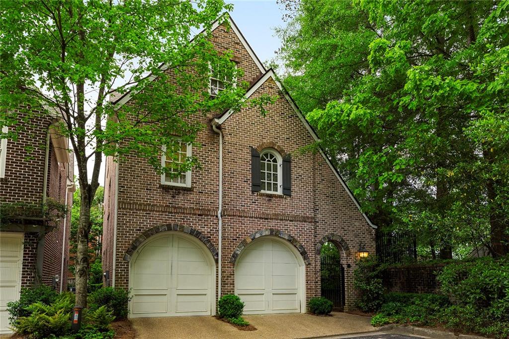 a front view of a house with garage