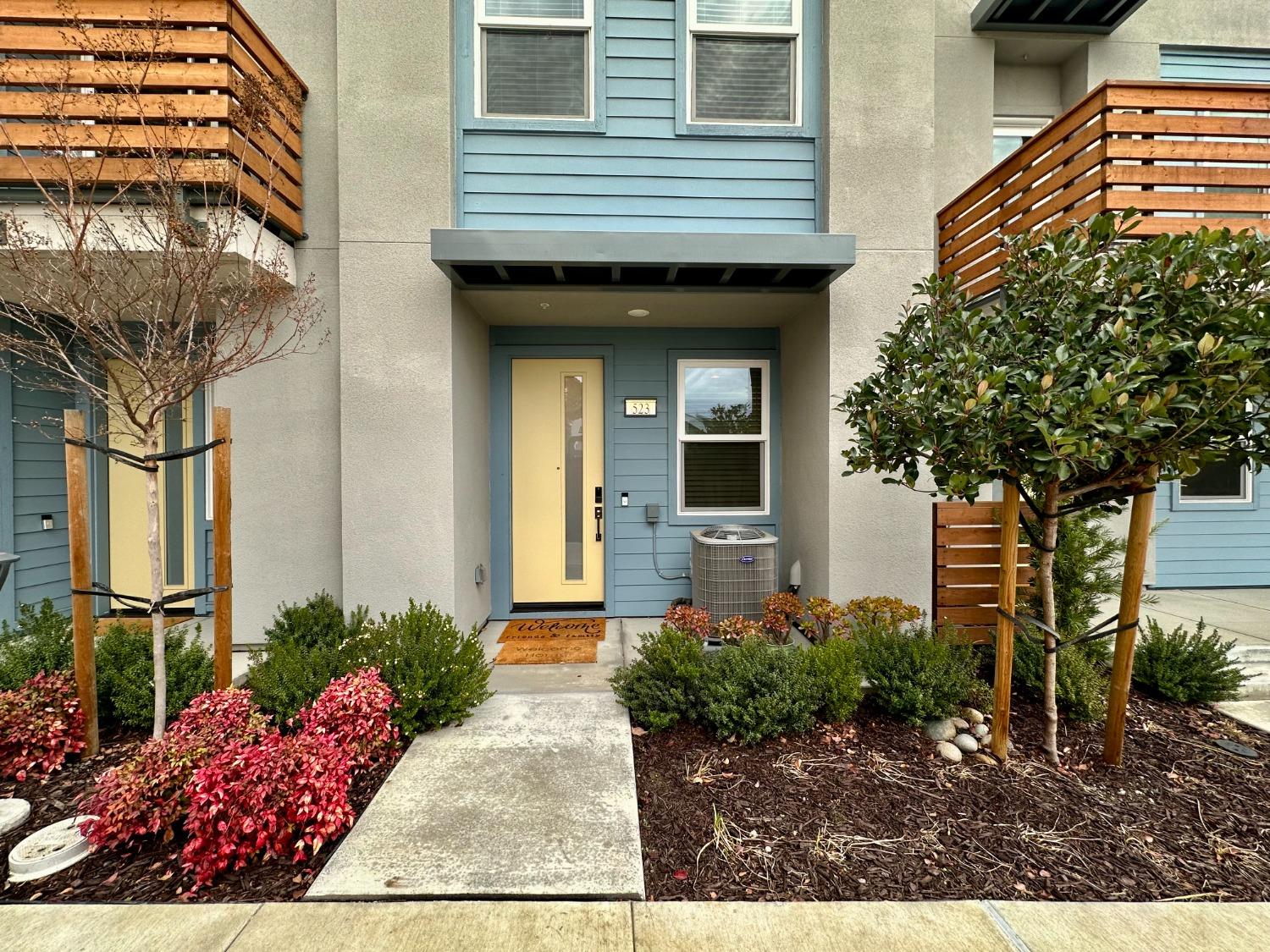 a front view of a house with a yard