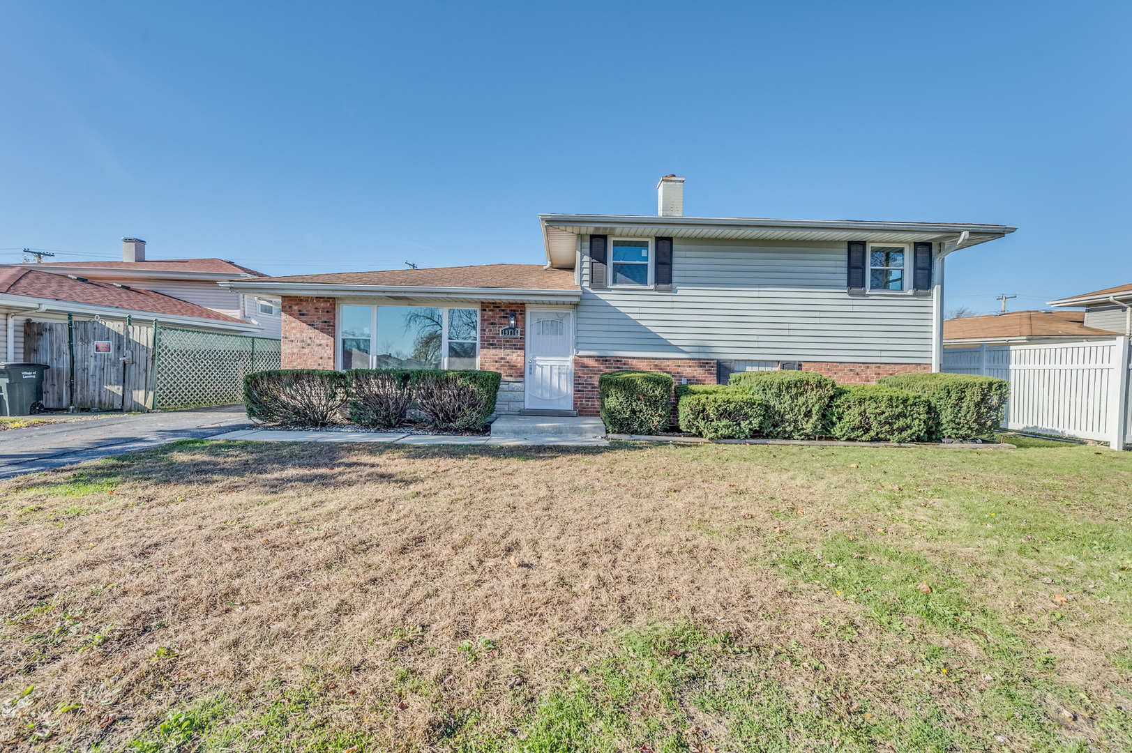 front view of a house with a yard