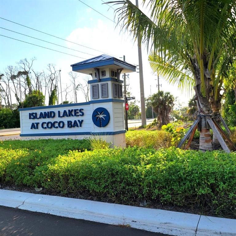 a view of a sign board with yard