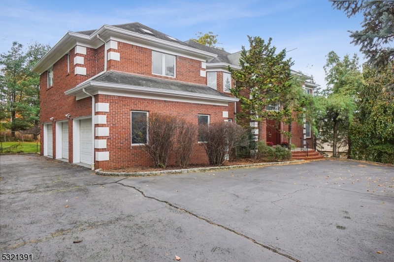 a view of a house with a outdoor space and parking