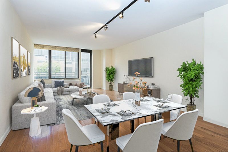 a view of a dining room with furniture window and wooden floor