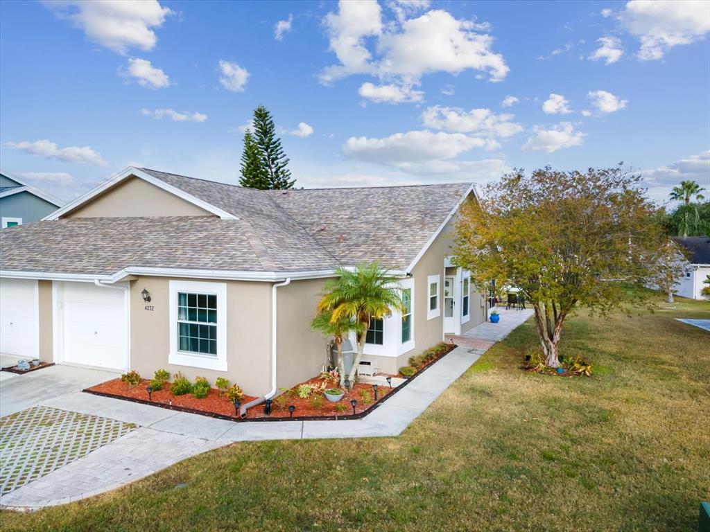 a front view of house with a garden