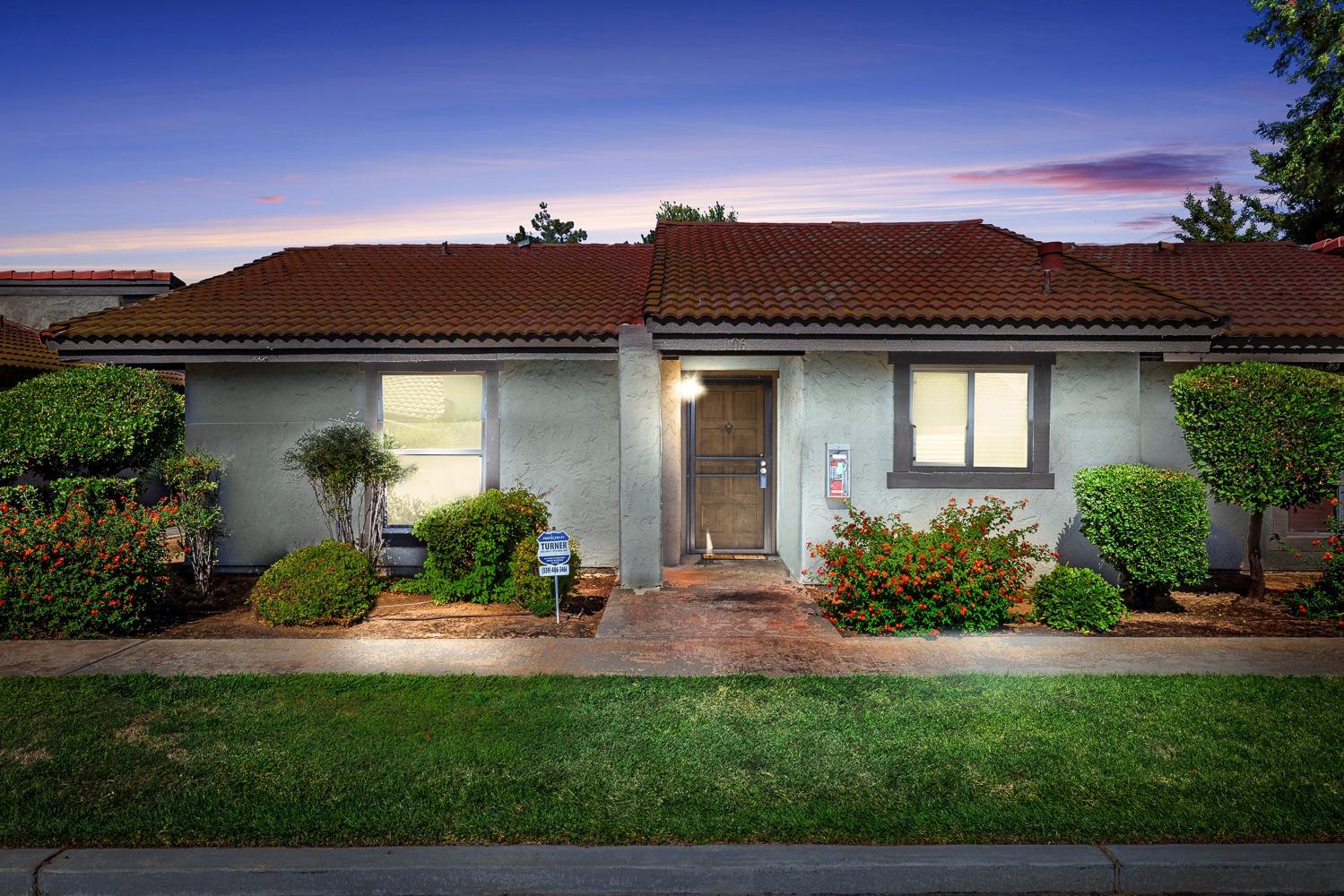 a front view of a house with a yard