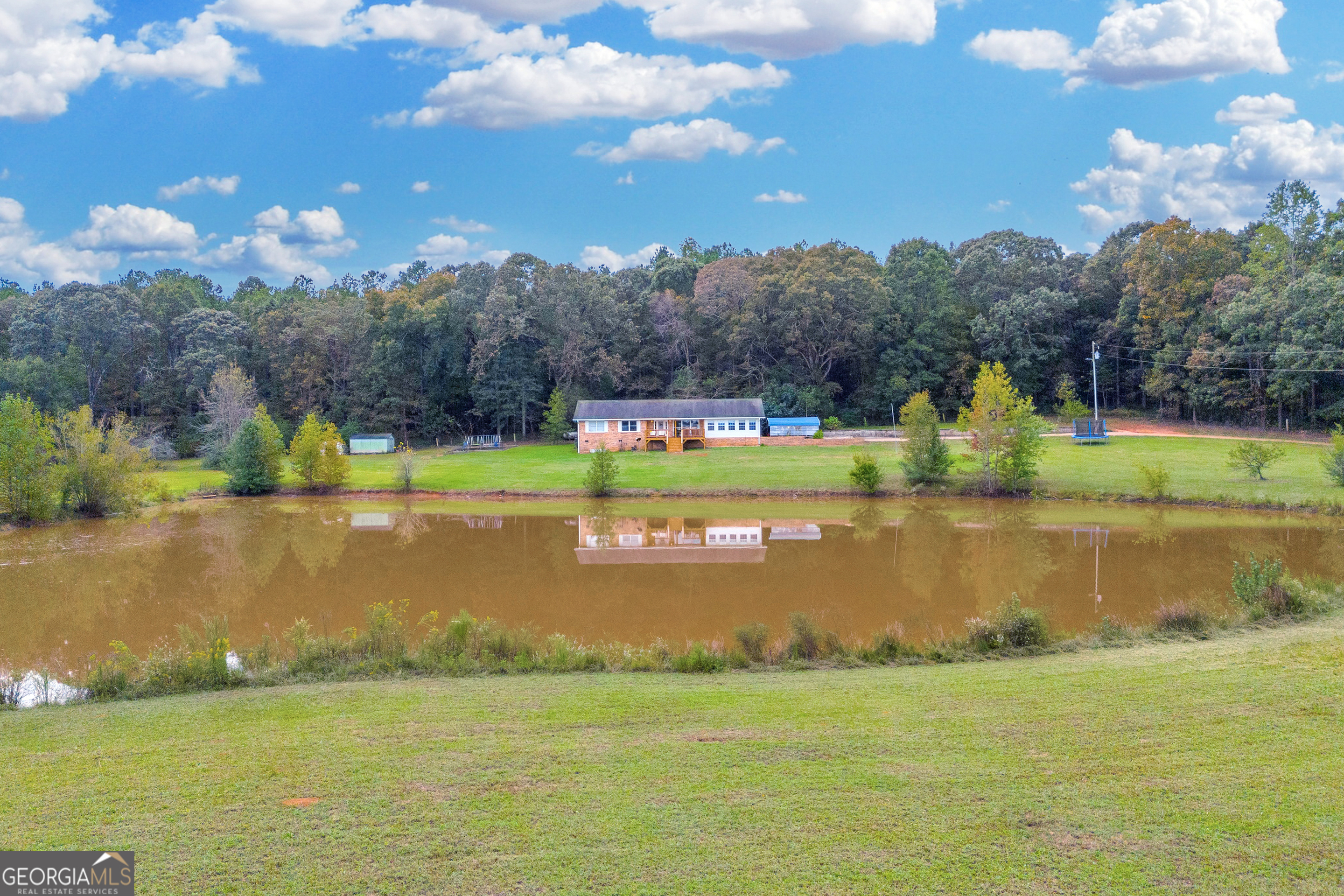 a view of a lake with a yard