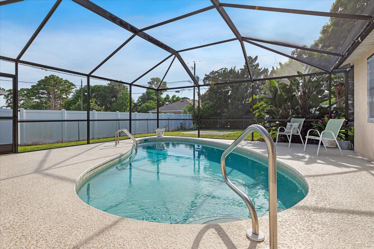 a view of a swimming pool with a patio