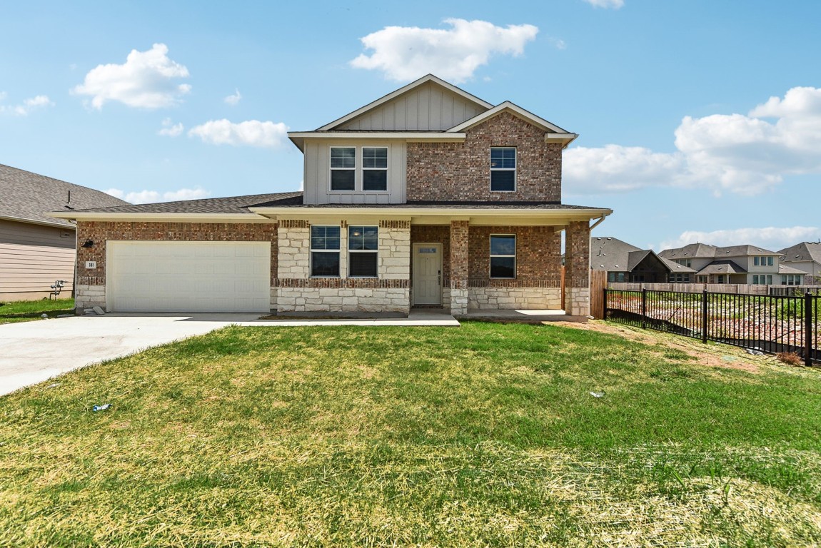 front view of a house with a yard