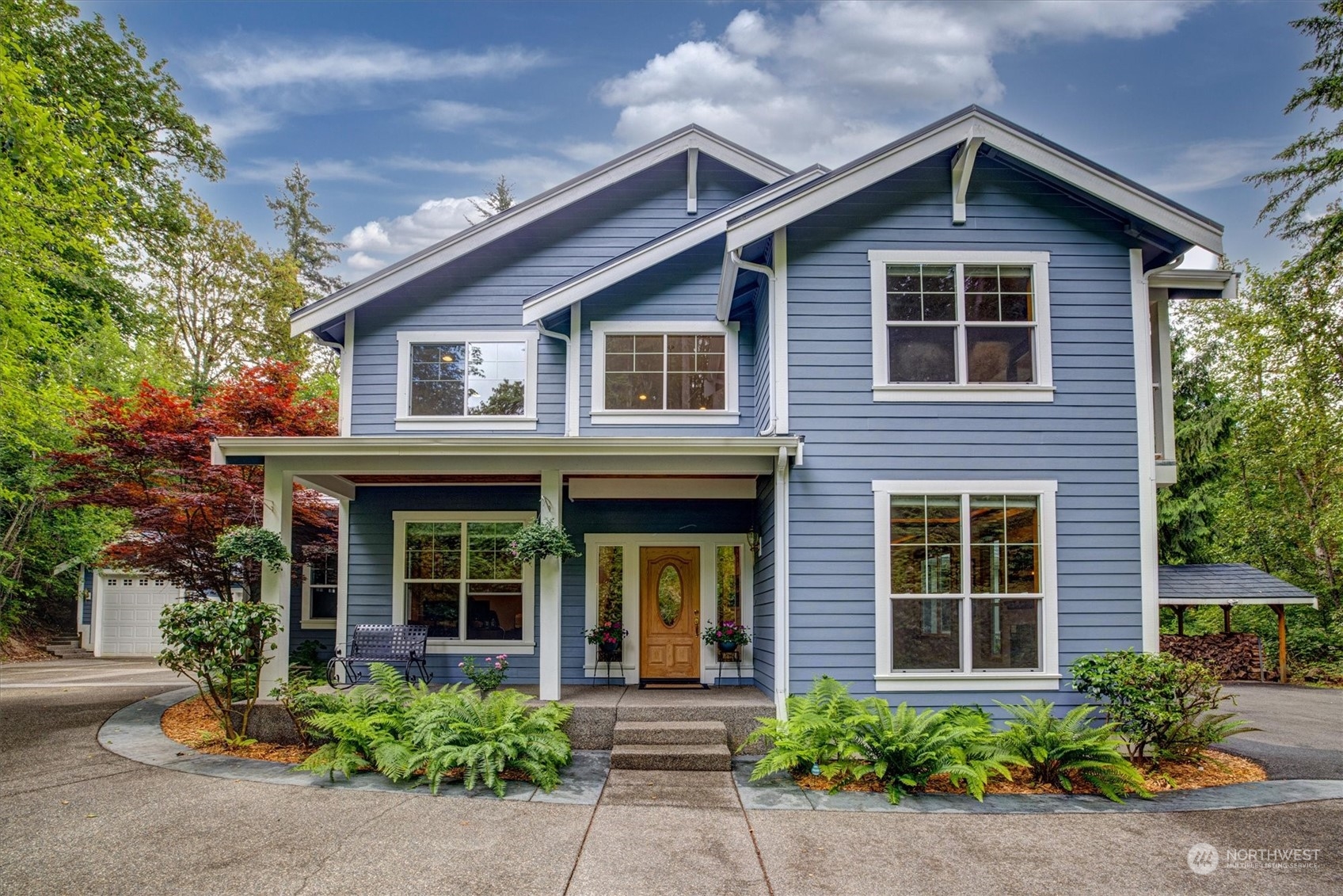 a front view of a house with garden