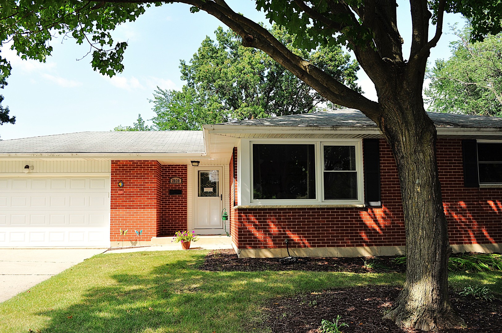 front view of a house with a yard