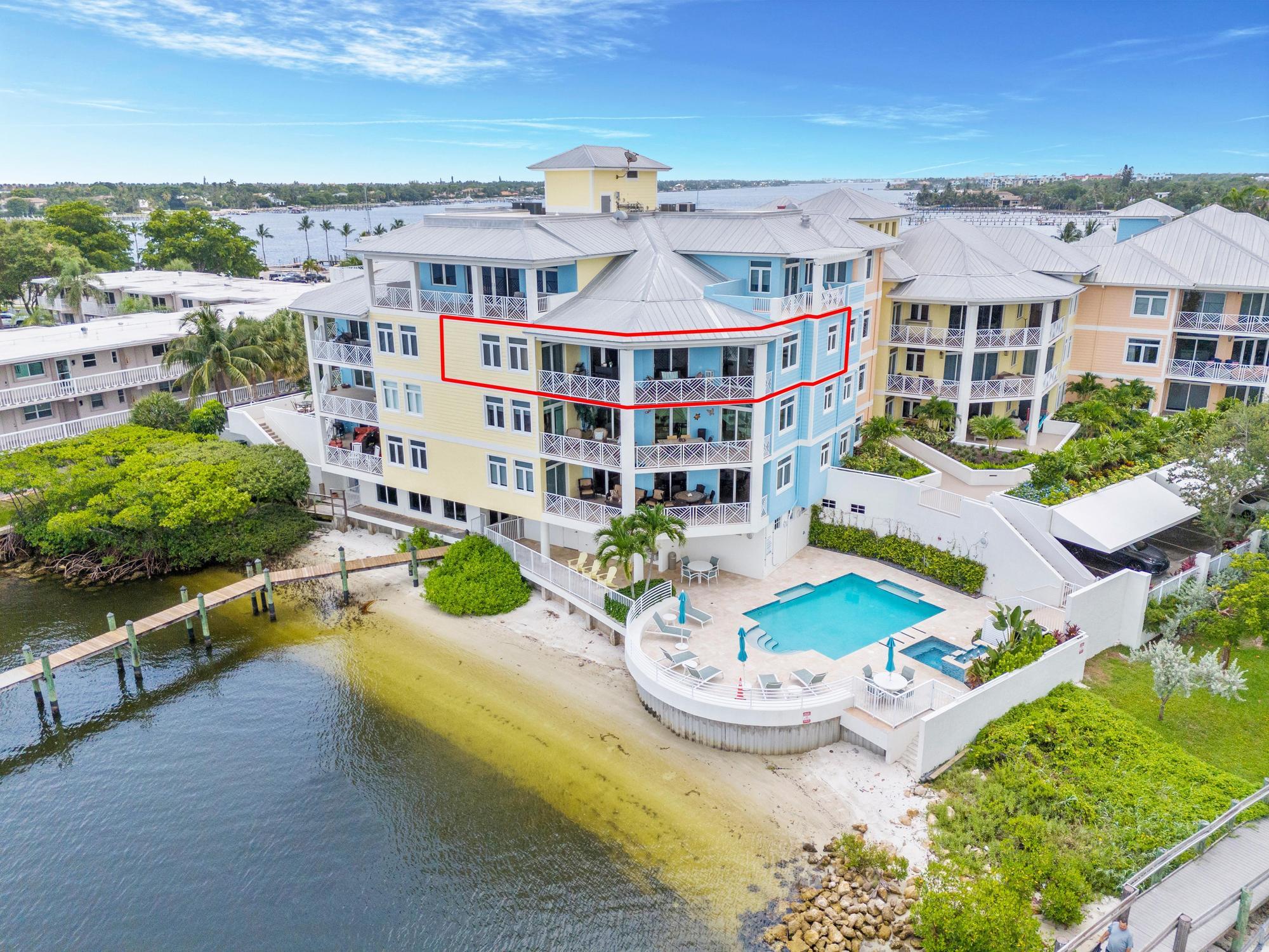 an aerial view of a house with outdoor seating