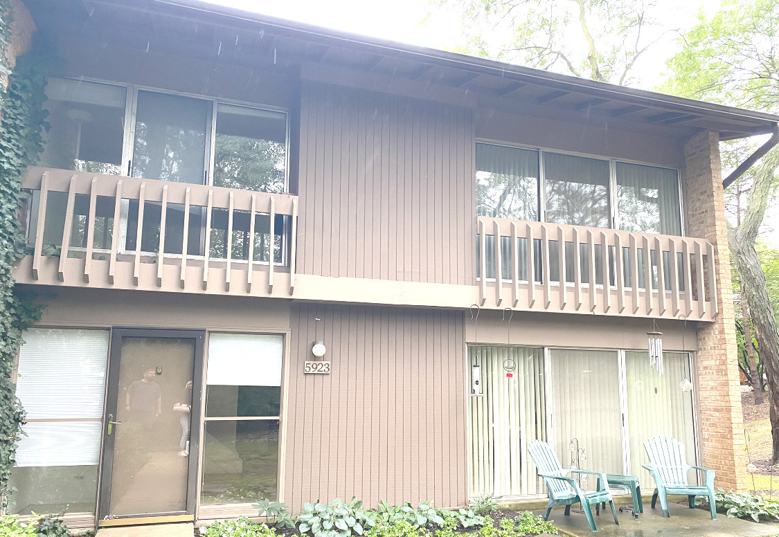 a view of a house with porch and wooden floor