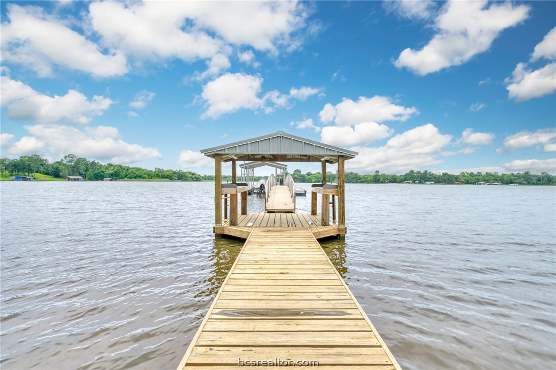 a view of a lake with outdoor seating