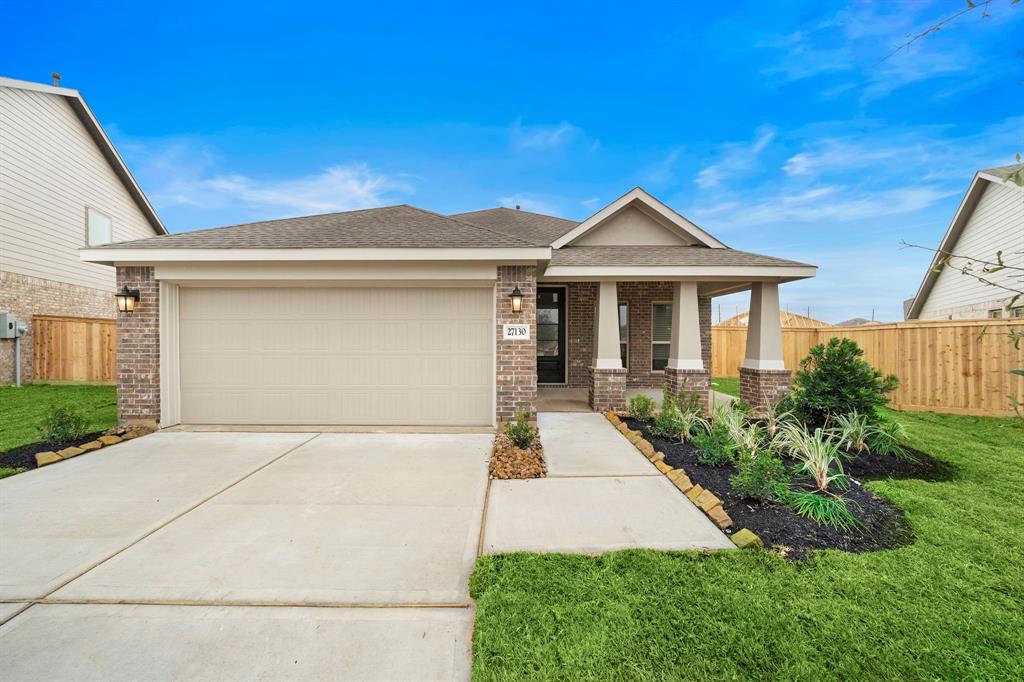 a front view of a house with yard