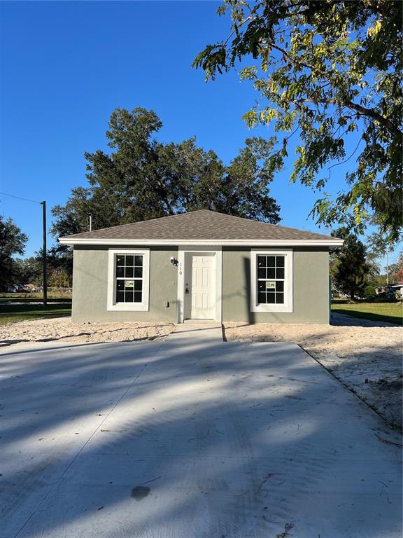 a front view of a house with a garage