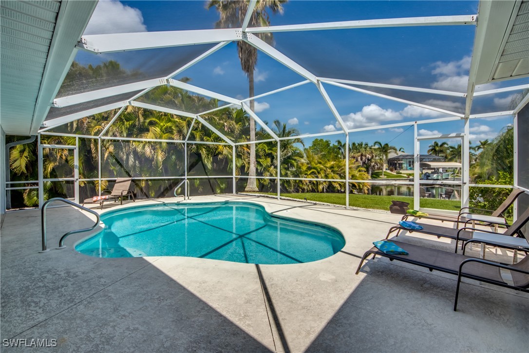 a view of a swimming pool with a lounge chair