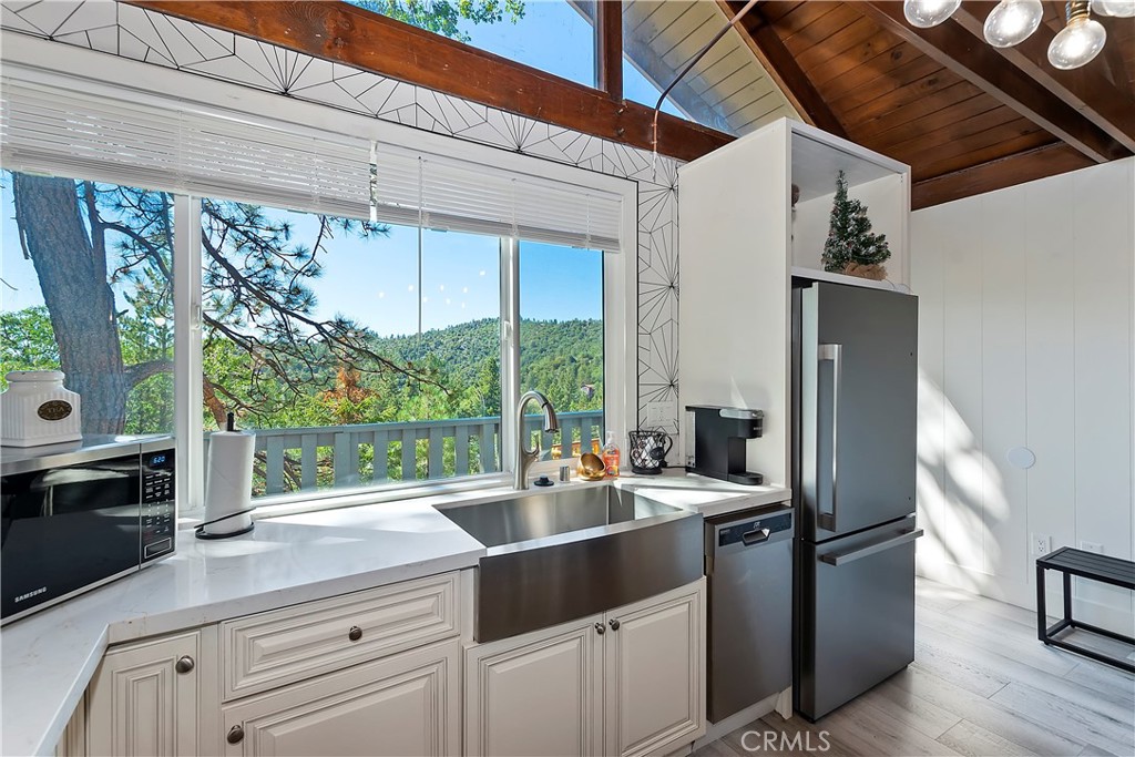 a kitchen with a sink and wooden cabinets