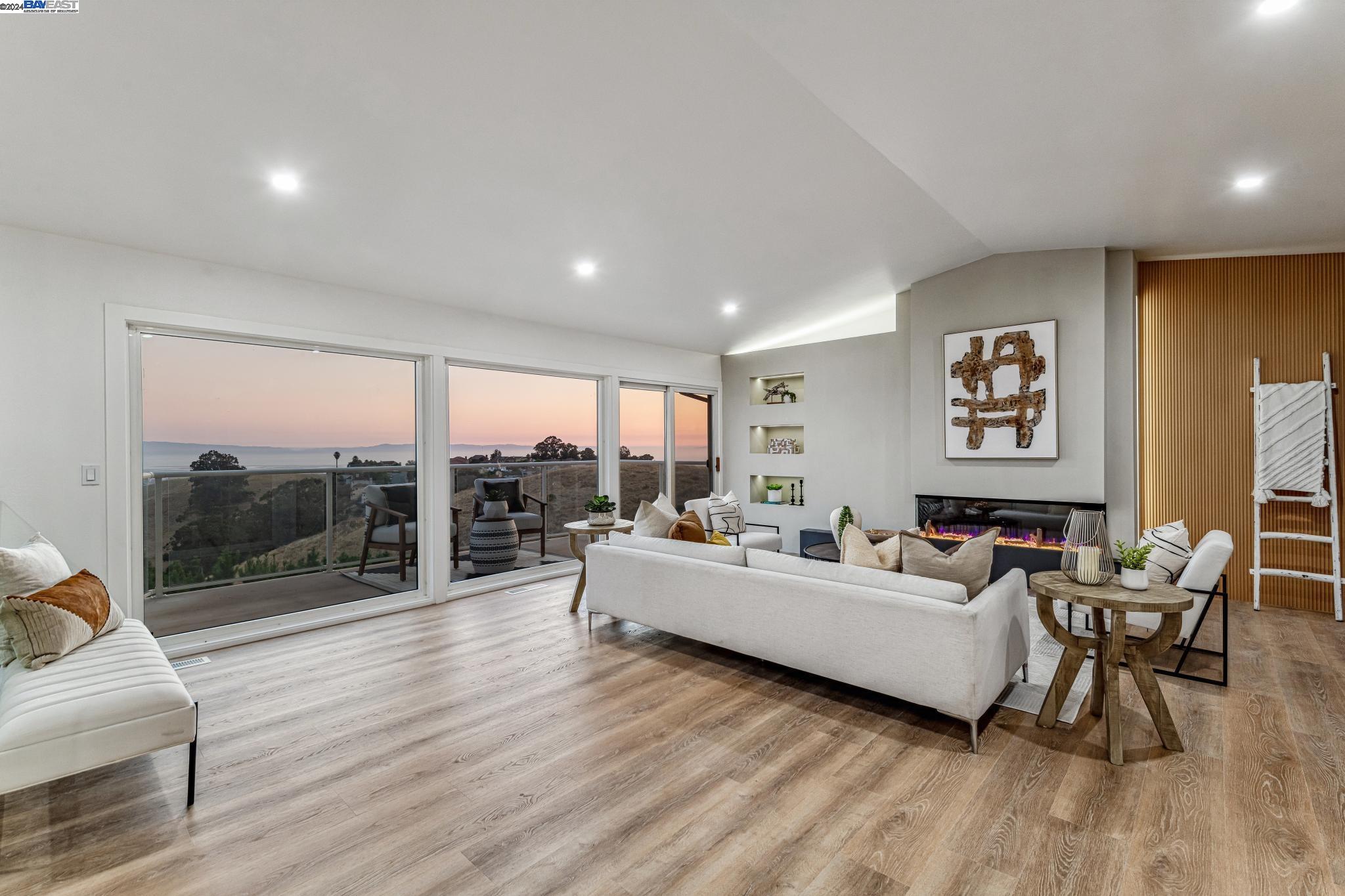 a living room with fireplace furniture and a flat screen tv