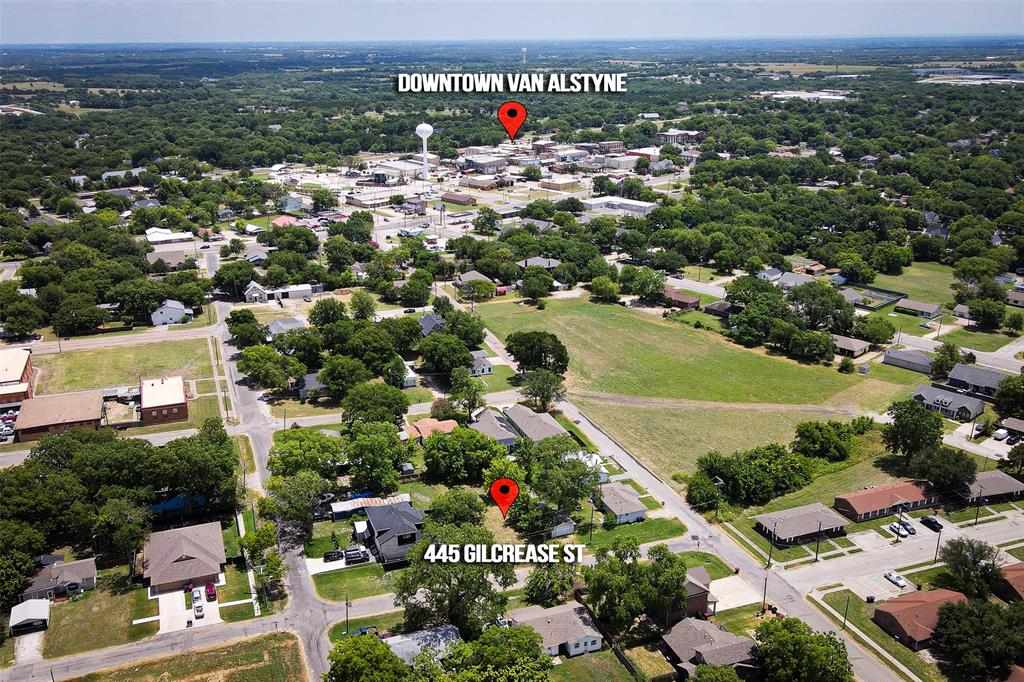 an aerial view of residential houses with outdoor space