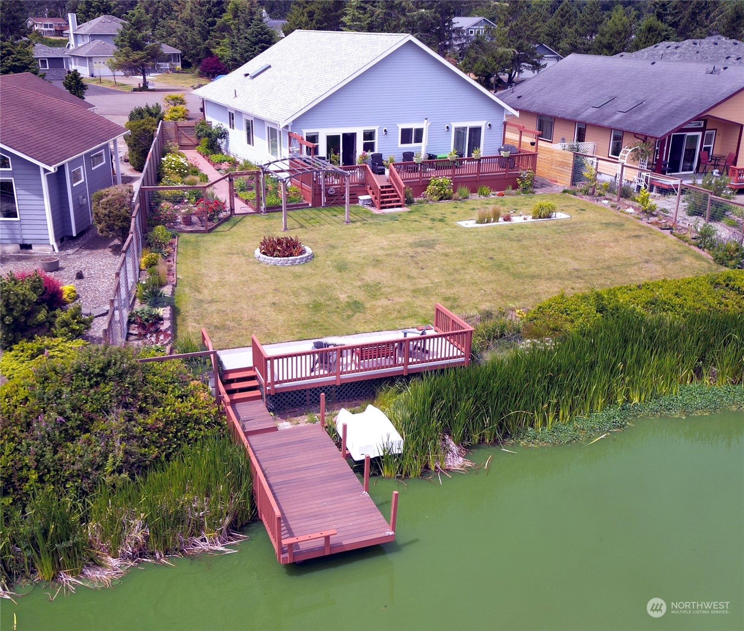 aerial view of a house with swimming pool yard and outdoor seating