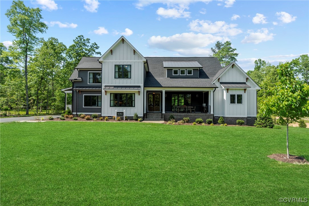 a front view of a house with a garden and porch