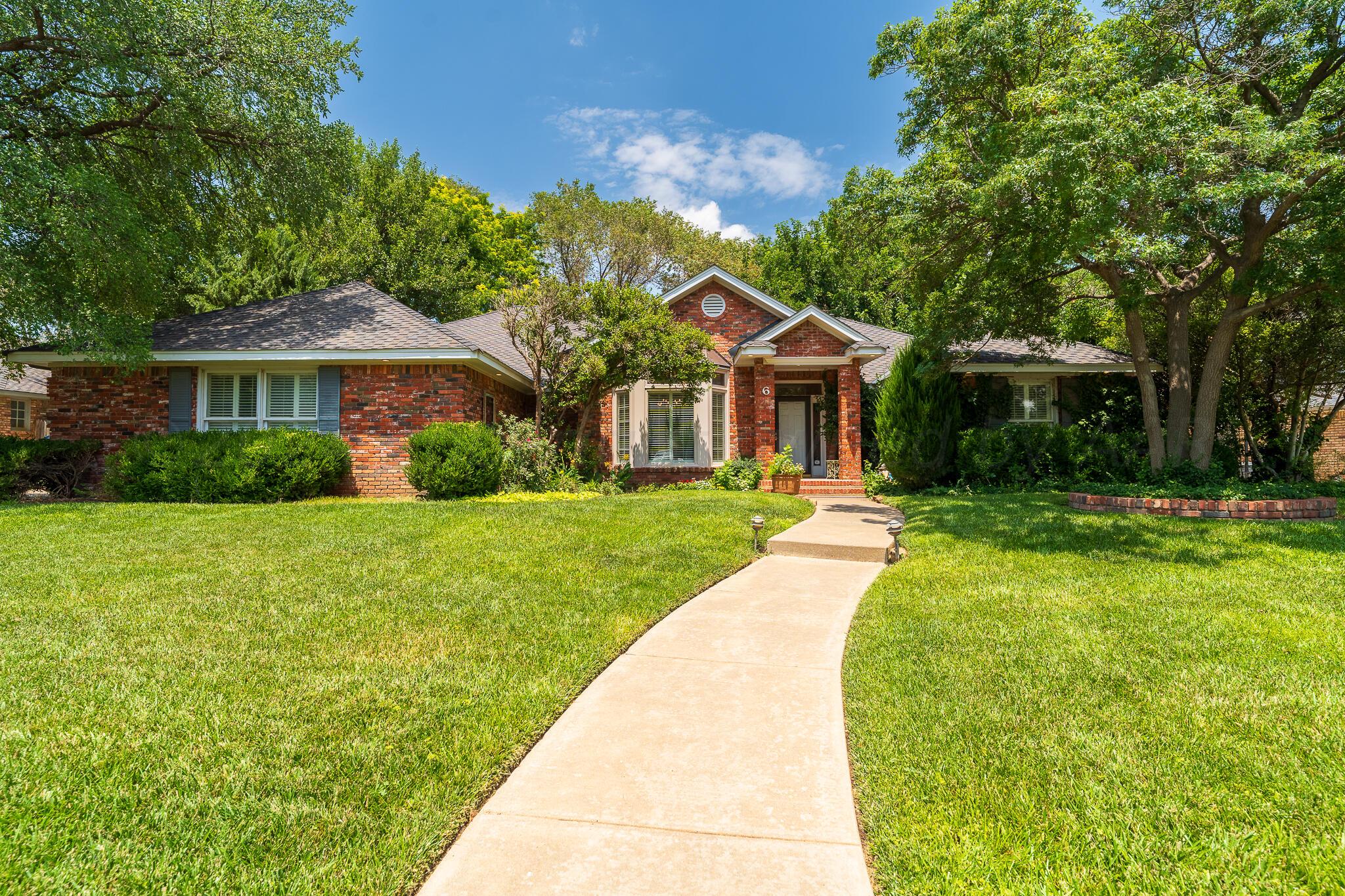 a front view of a house with yard