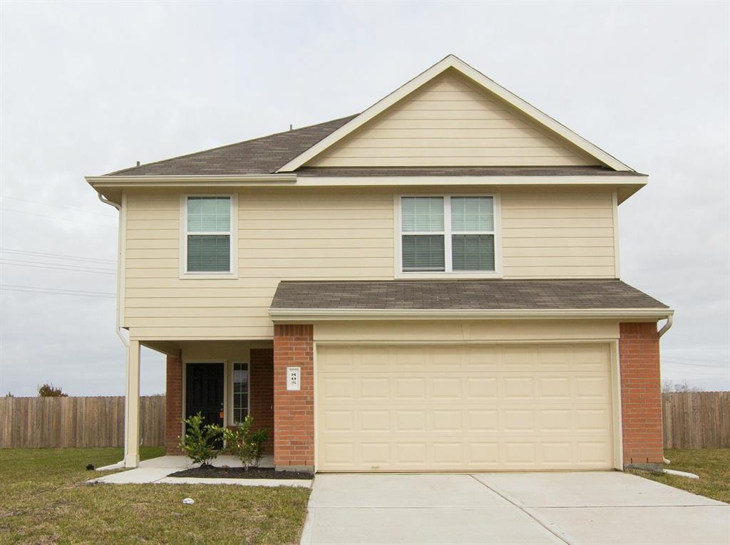 a front view of a house with garage