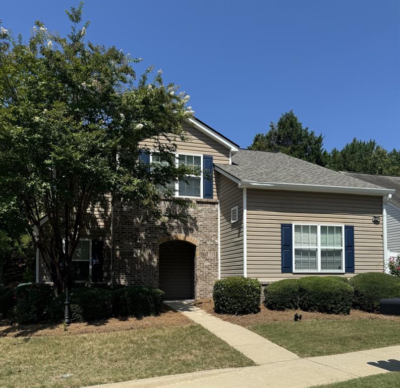 a front view of a house with yard