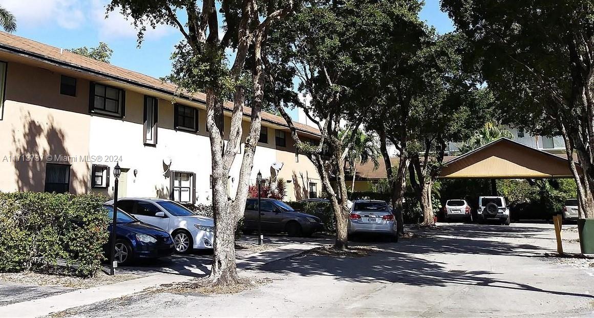 a front view of a house with street view