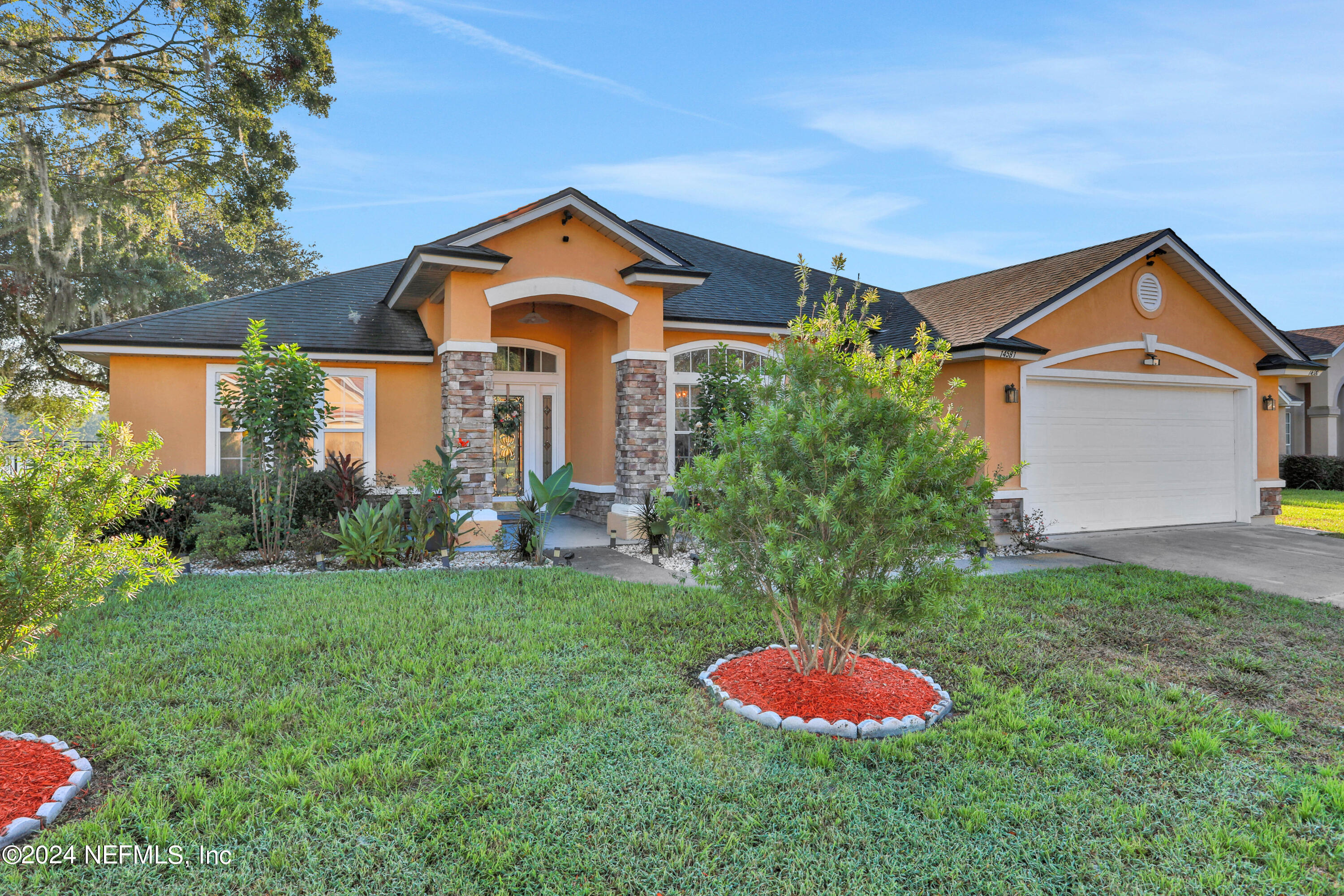 a front view of a house with a yard