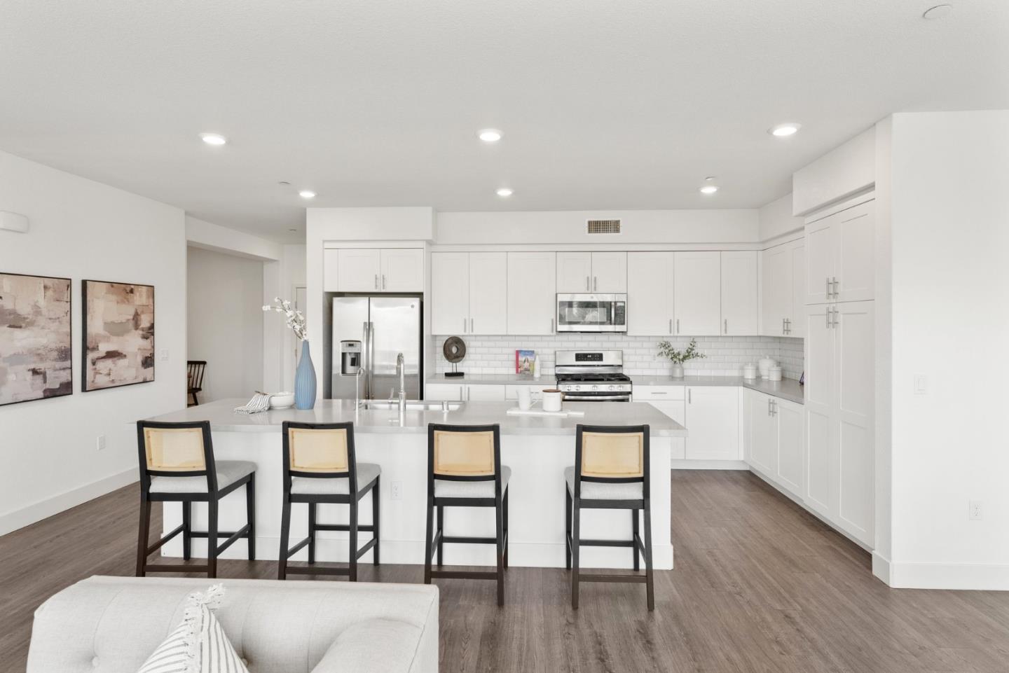 a kitchen with appliances and cabinets