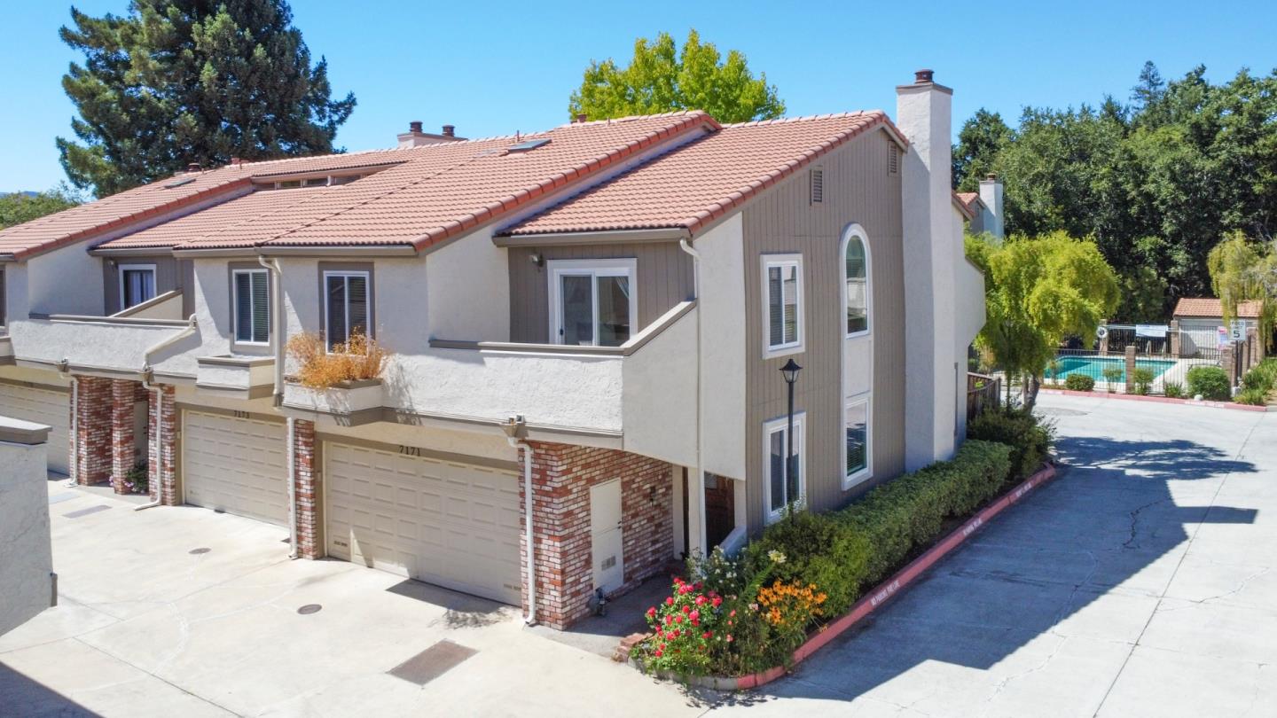 a aerial view of a house with yard and sitting area