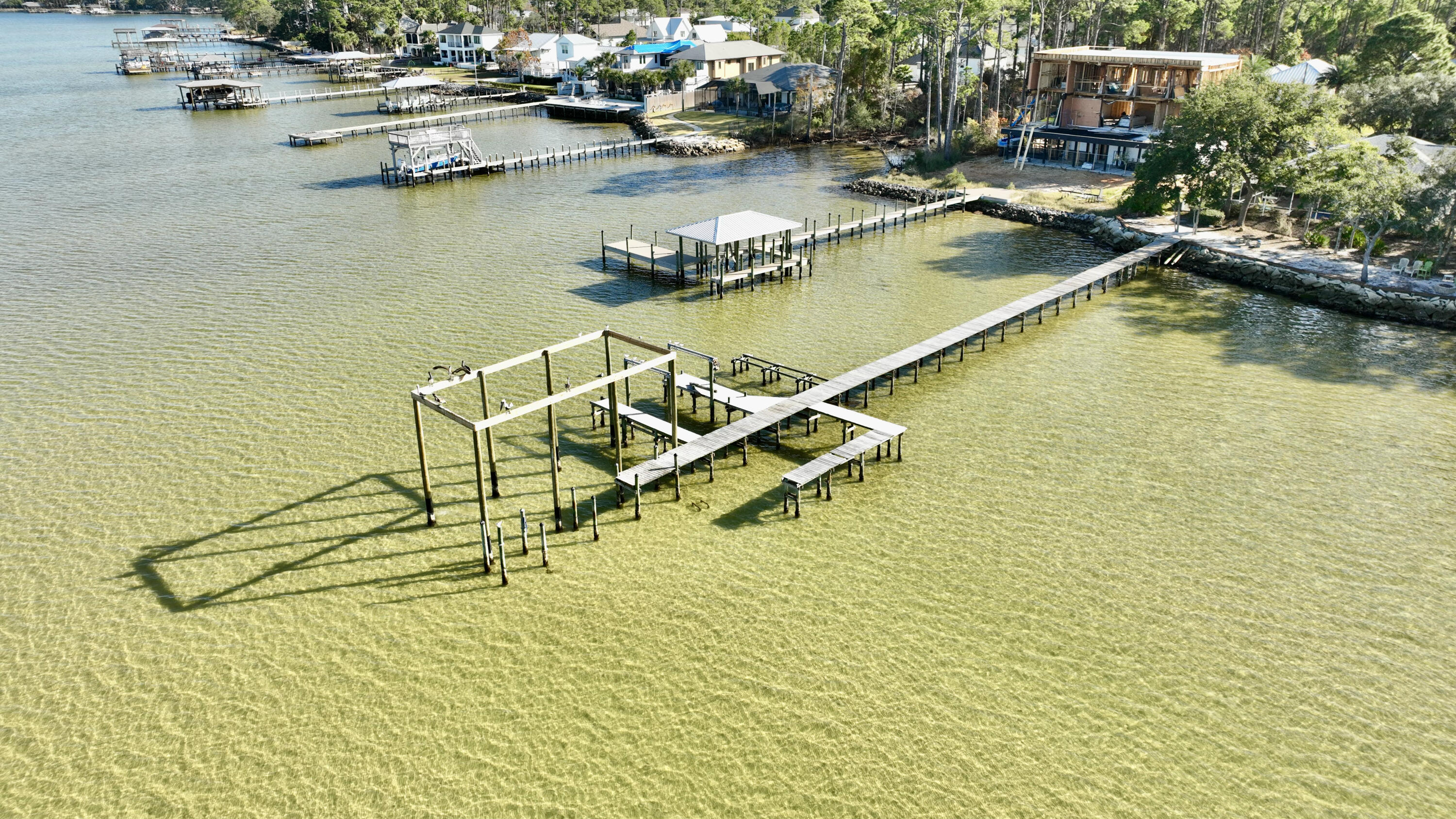 a view of a lake with chairs