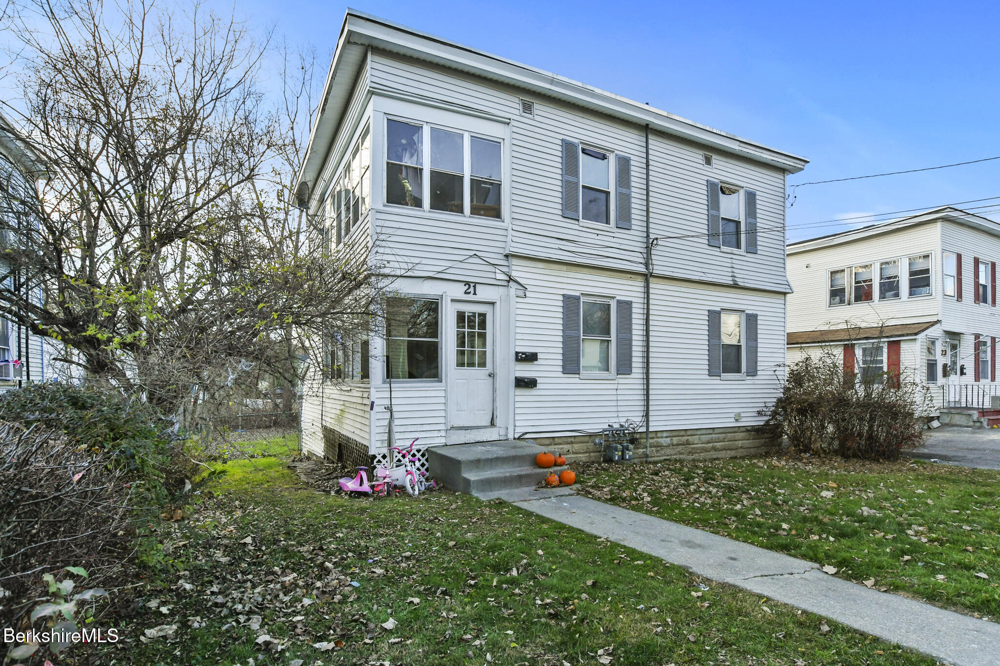 a front view of a house with a yard