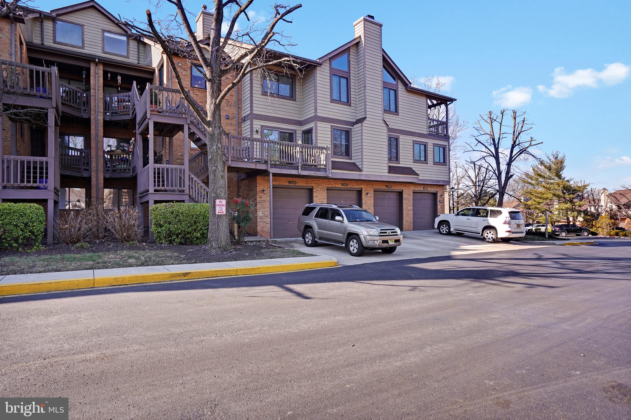 a front view of a building with small garden and entertaining space