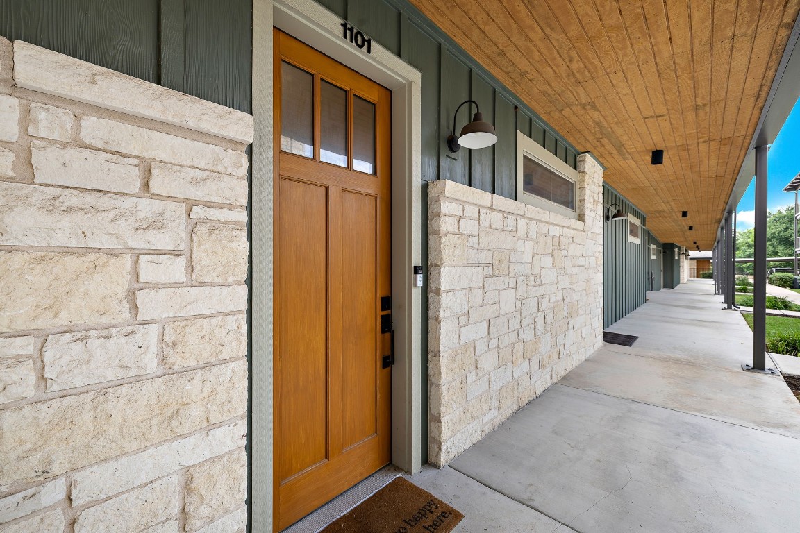 a view of a brick buildings with entryway doors