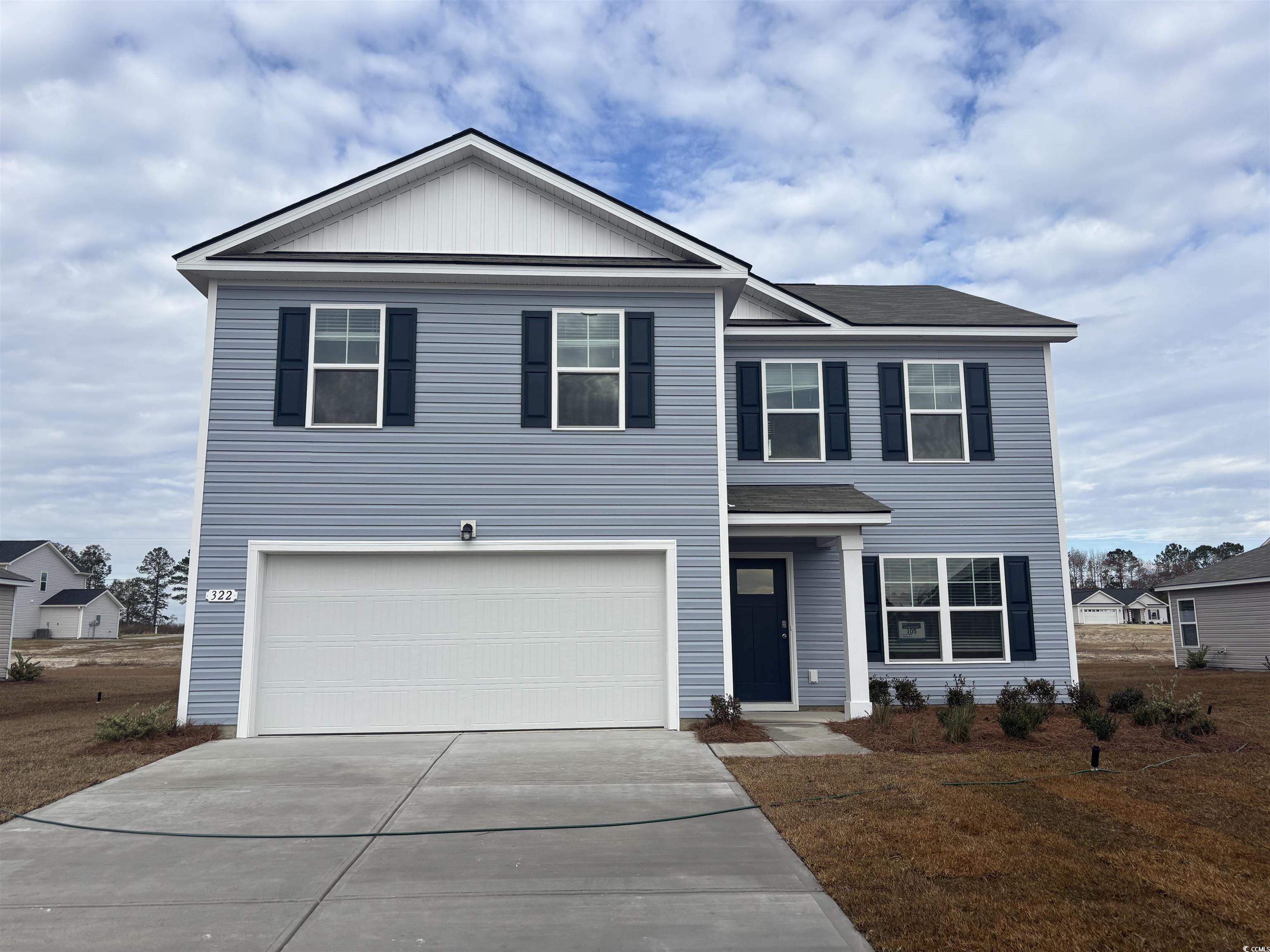 View of front of home featuring a garage