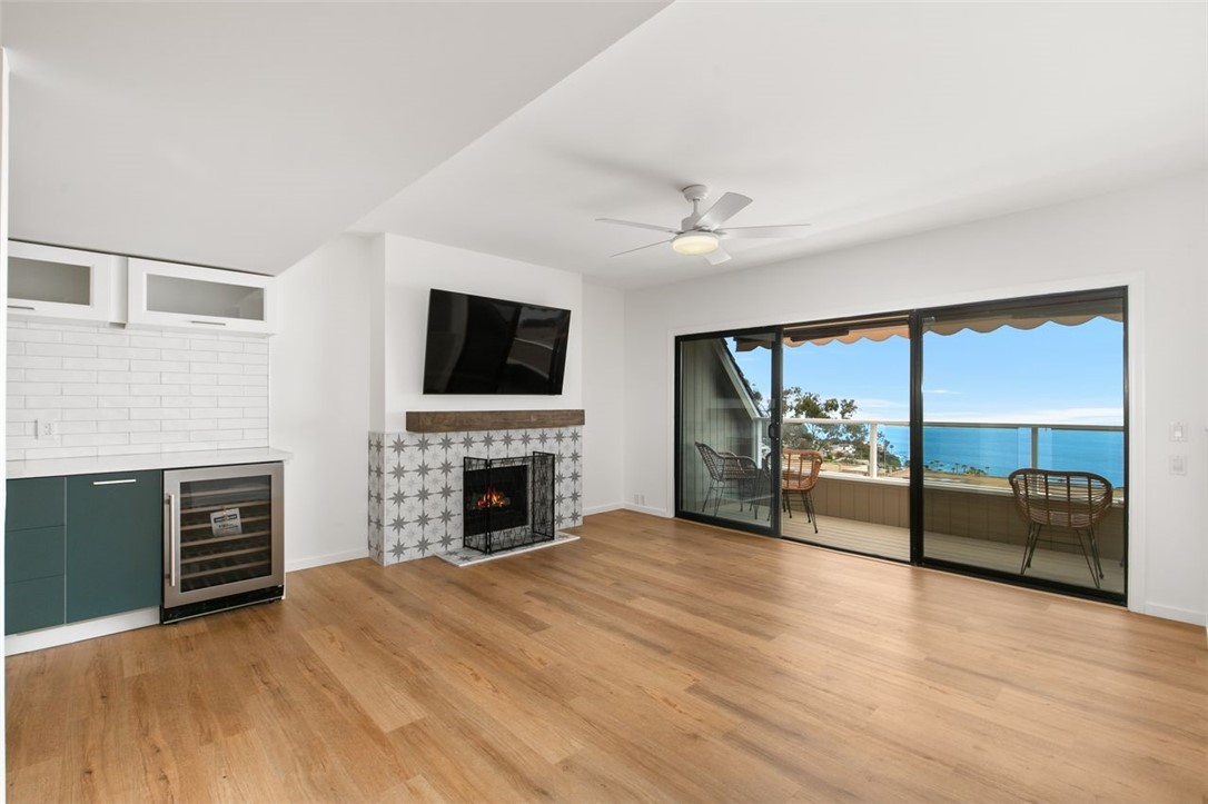 a view of livingroom with furniture fireplace and window