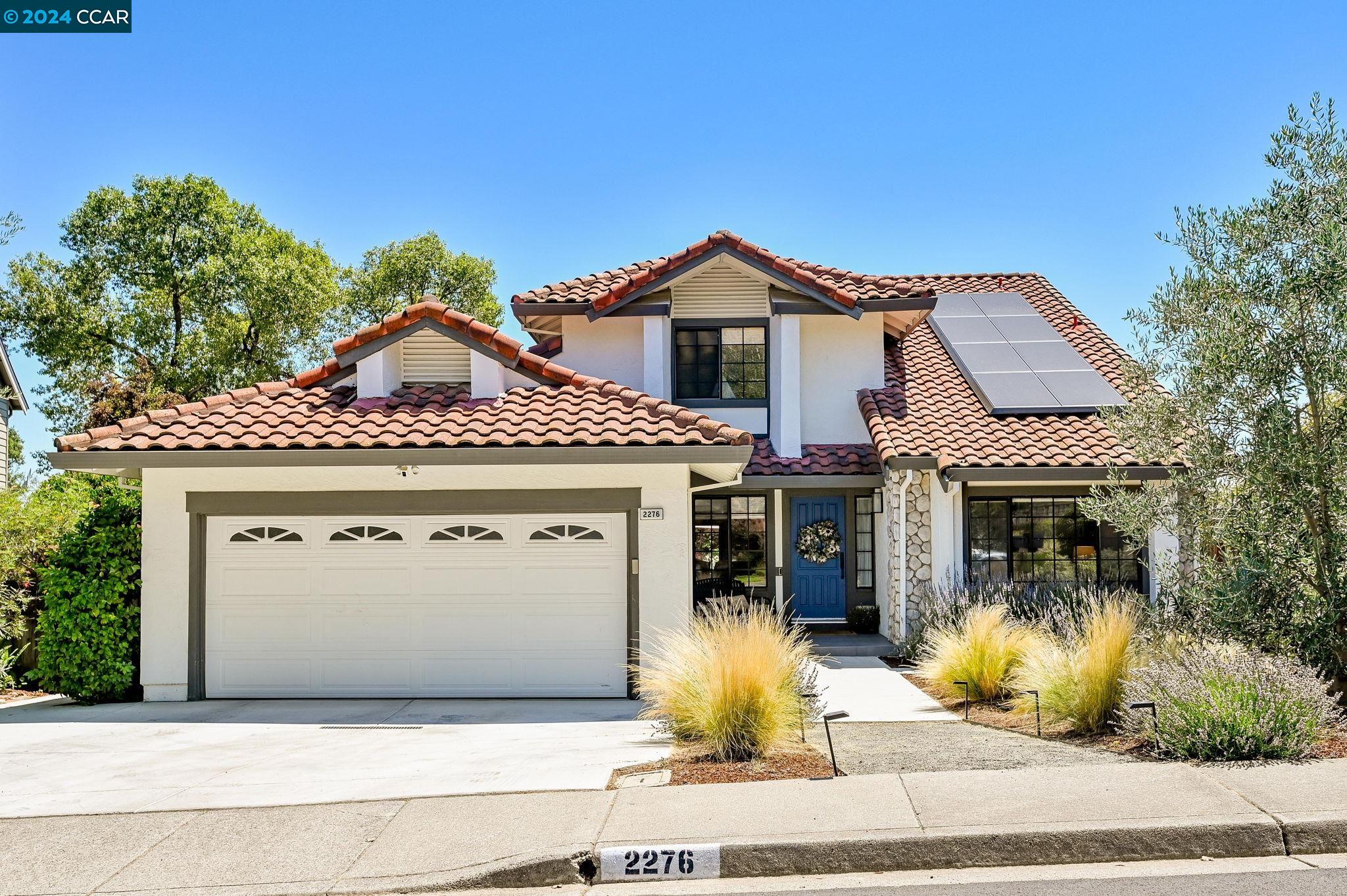 a front view of a house with a garage