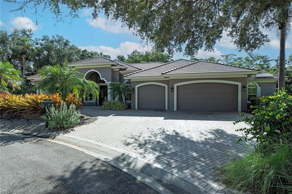 front view of a house with a garden