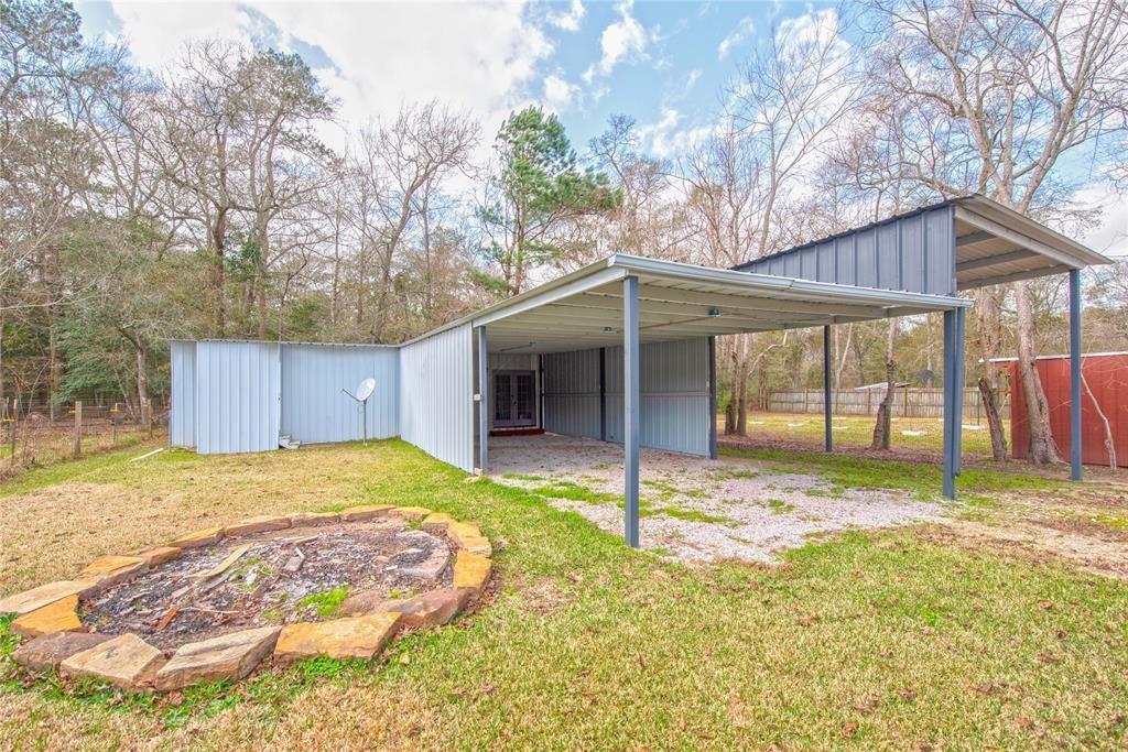 a backyard of a house with a yard and garage