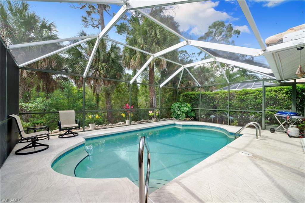 a view of a swimming pool with a patio