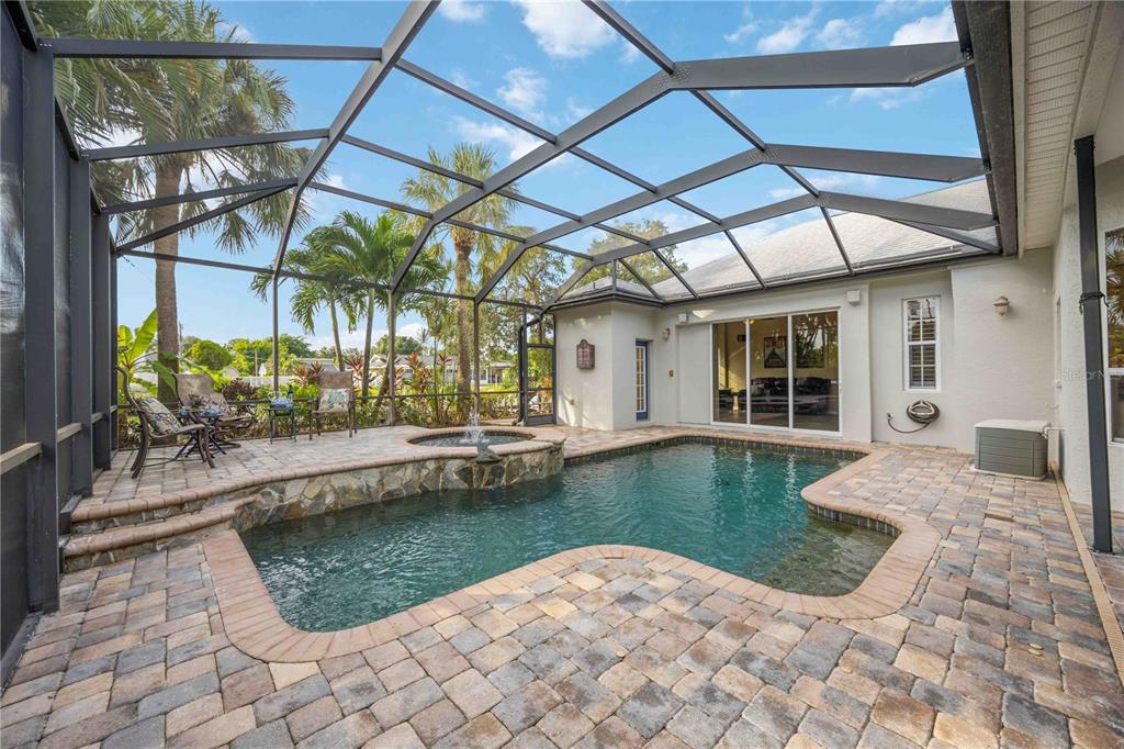 a view of swimming pool with outdoor seating