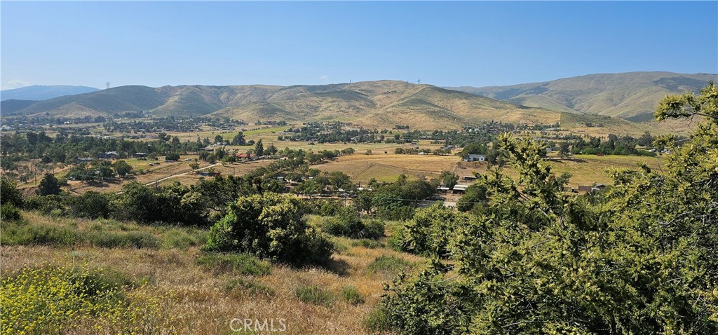 a view of a town with mountains in the background