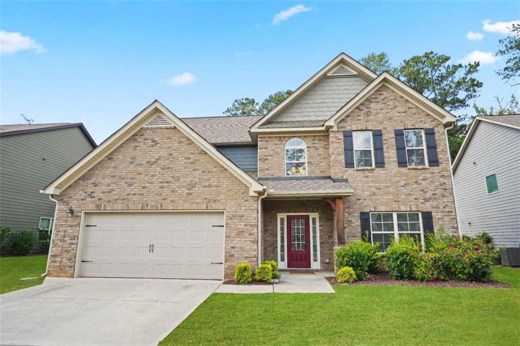 front view of a house with a yard