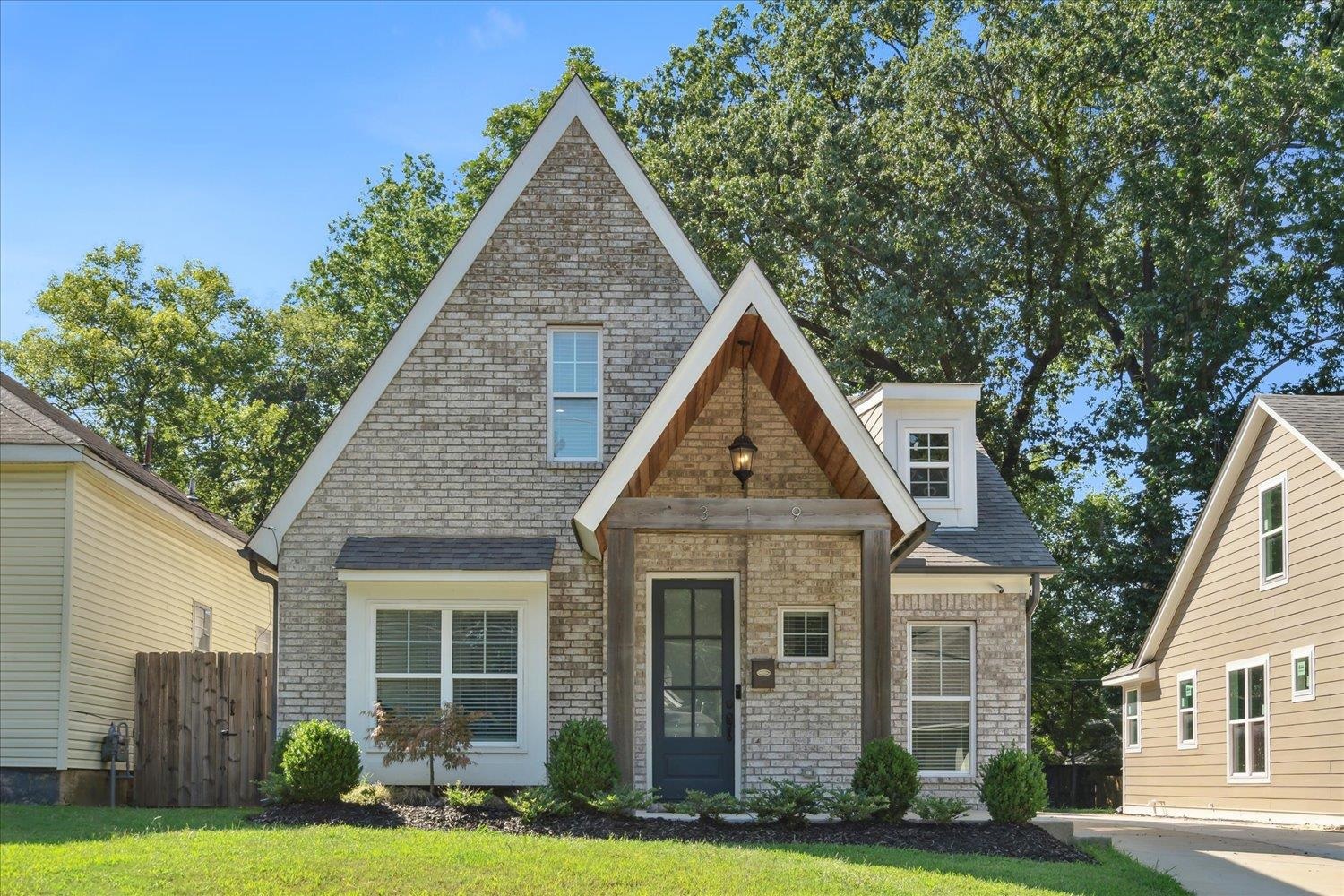 a front view of a house with yard