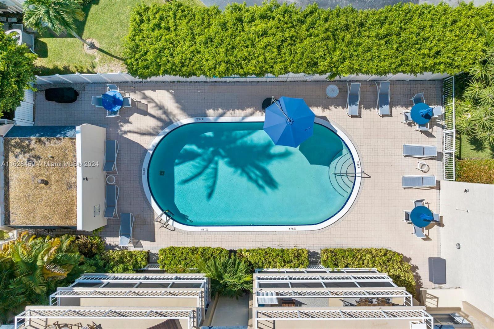 an aerial view of a house with a swimming pool