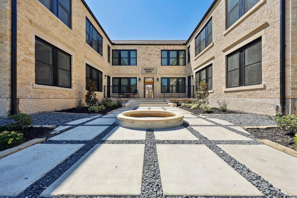 a front view of a house with a yard fire pit and outdoor seating