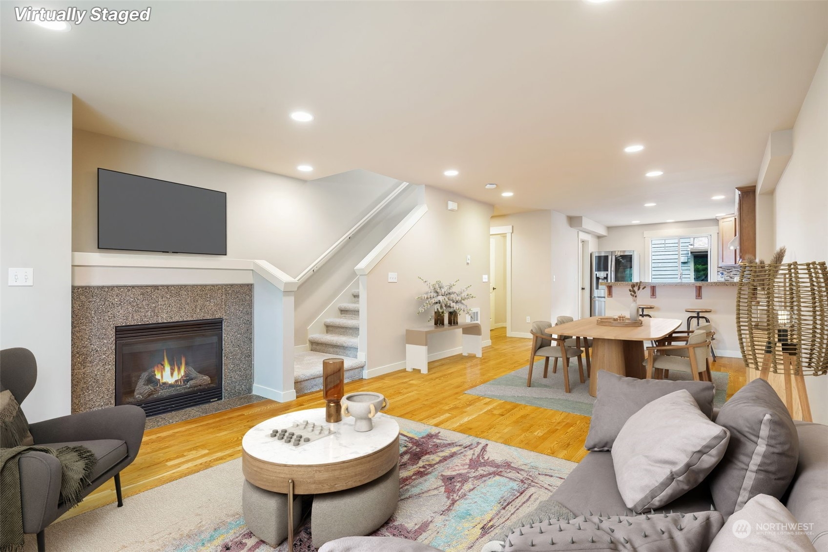 a living room with furniture a table and a fireplace